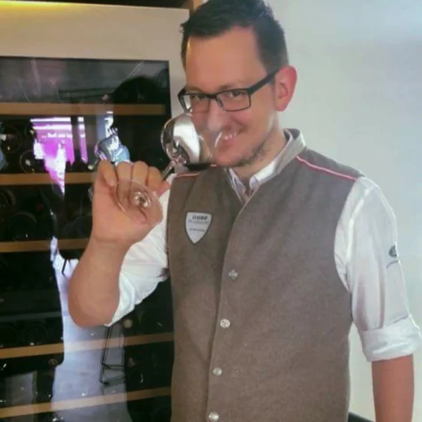 a man holding a wine glass